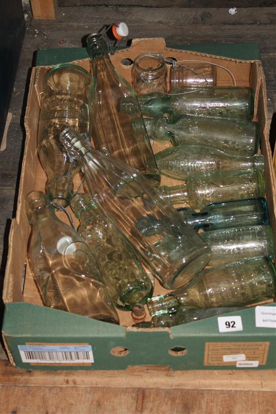 Approx 14 green glass bottles